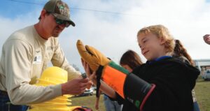 Taylor Hammack helps student